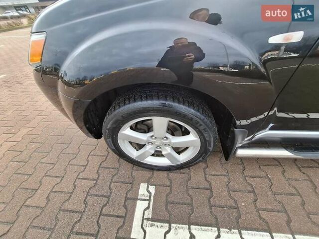 Черный Мицубиси Аутлендер ХЛ, объемом двигателя 2.36 л и пробегом 211 тыс. км за 10500 $, фото 6 на Automoto.ua