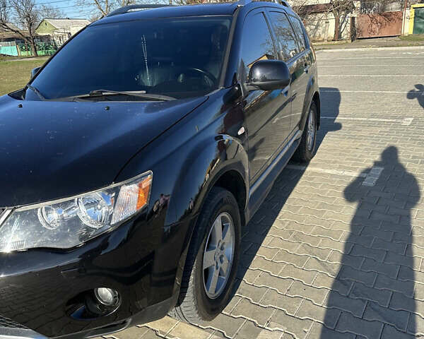 Черный Мицубиси Аутлендер ХЛ, объемом двигателя 2.4 л и пробегом 198 тыс. км за 11000 $, фото 4 на Automoto.ua
