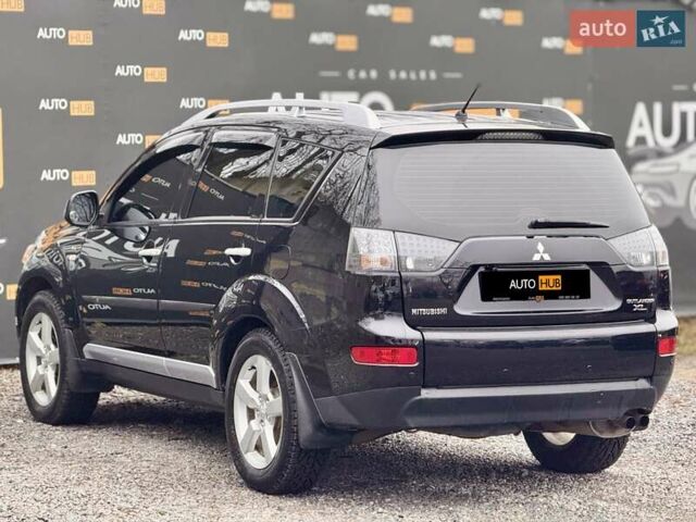 Черный Мицубиси Аутлендер ХЛ, объемом двигателя 3 л и пробегом 214 тыс. км за 9500 $, фото 5 на Automoto.ua