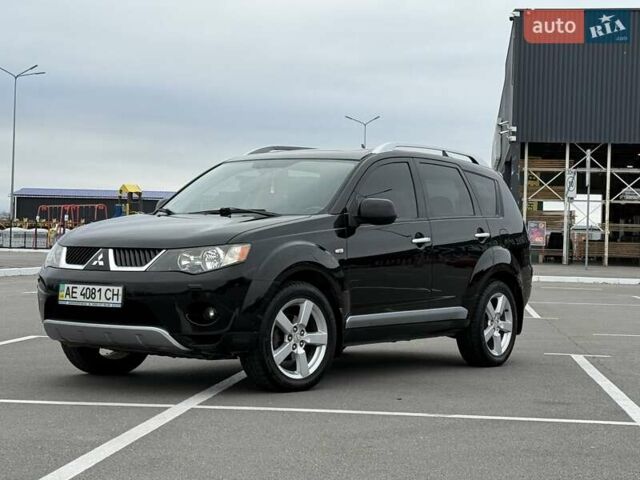 Черный Мицубиси Аутлендер ХЛ, объемом двигателя 2.36 л и пробегом 175 тыс. км за 9700 $, фото 1 на Automoto.ua