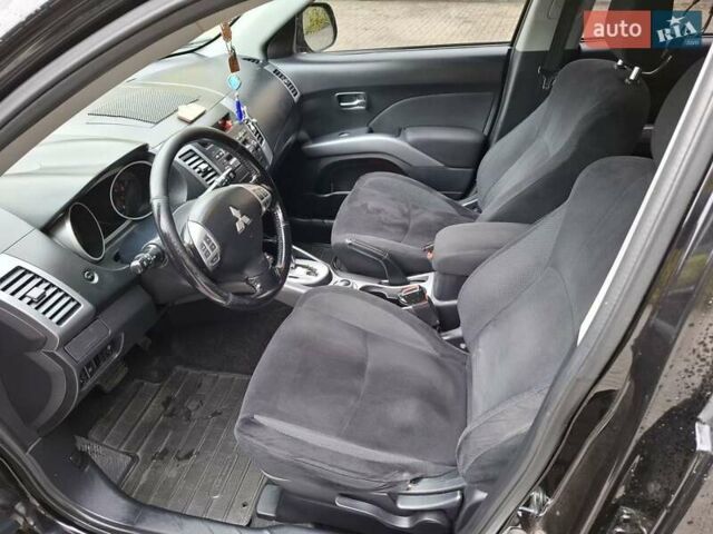 Черный Мицубиси Аутлендер ХЛ, объемом двигателя 2.4 л и пробегом 127 тыс. км за 10500 $, фото 30 на Automoto.ua