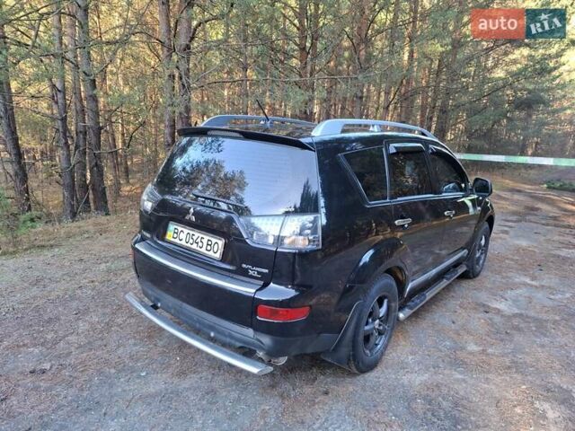 Черный Мицубиси Аутлендер ХЛ, объемом двигателя 2.4 л и пробегом 127 тыс. км за 10500 $, фото 24 на Automoto.ua