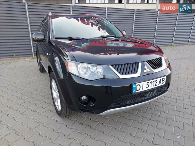 Чорний Міцубісі Аутлендер ХЛ, об'ємом двигуна 2.4 л та пробігом 181 тис. км за 8990 $, фото 1 на Automoto.ua