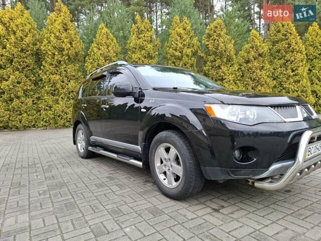 Черный Мицубиси Аутлендер ХЛ, объемом двигателя 2.4 л и пробегом 127 тыс. км за 10500 $, фото 1 на Automoto.ua