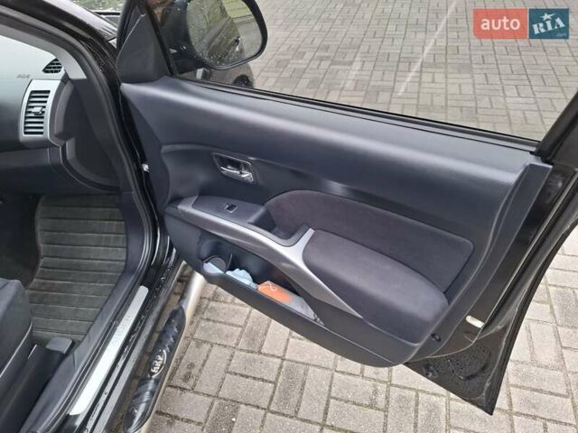 Черный Мицубиси Аутлендер ХЛ, объемом двигателя 2.4 л и пробегом 127 тыс. км за 10500 $, фото 38 на Automoto.ua