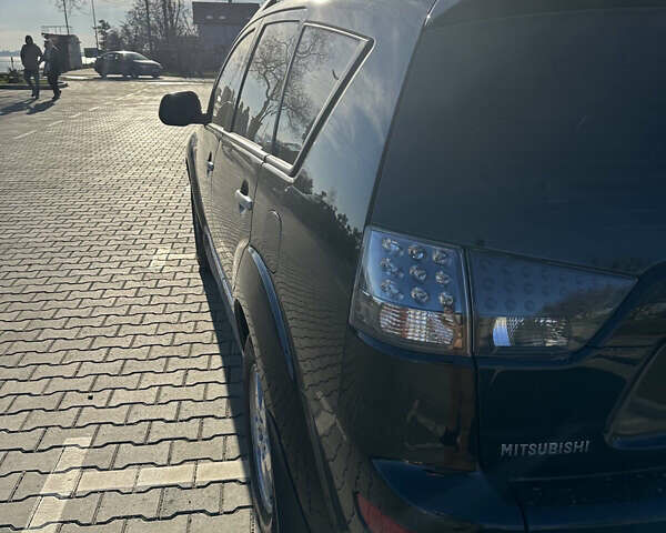 Черный Мицубиси Аутлендер ХЛ, объемом двигателя 2.4 л и пробегом 198 тыс. км за 11000 $, фото 7 на Automoto.ua