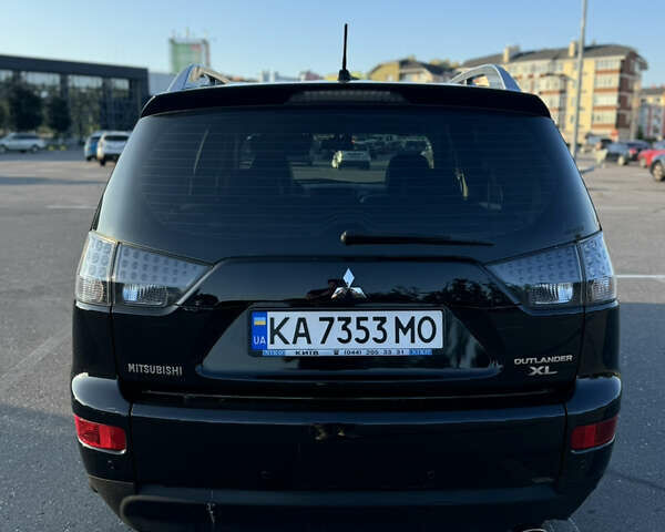 Черный Мицубиси Аутлендер ХЛ, объемом двигателя 2.36 л и пробегом 115 тыс. км за 12000 $, фото 9 на Automoto.ua