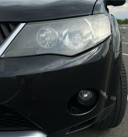 Черный Мицубиси Аутлендер ХЛ, объемом двигателя 2.4 л и пробегом 212 тыс. км за 9350 $, фото 45 на Automoto.ua