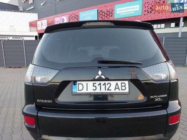 Чорний Міцубісі Аутлендер ХЛ, об'ємом двигуна 2.4 л та пробігом 181 тис. км за 8990 $, фото 11 на Automoto.ua