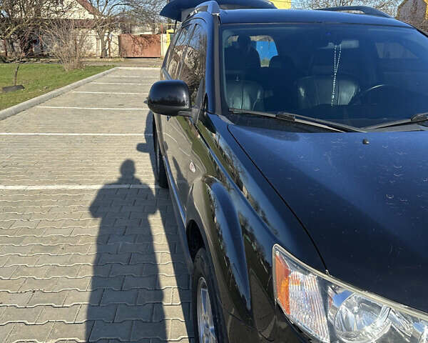 Черный Мицубиси Аутлендер ХЛ, объемом двигателя 2.4 л и пробегом 198 тыс. км за 11000 $, фото 5 на Automoto.ua