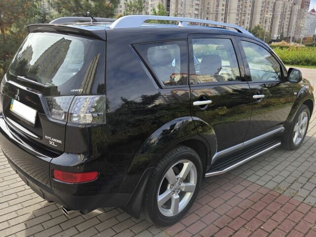 Черный Мицубиси Аутлендер ХЛ, объемом двигателя 2.4 л и пробегом 31 тыс. км за 15000 $, фото 3 на Automoto.ua