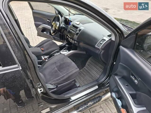 Черный Мицубиси Аутлендер ХЛ, объемом двигателя 2.4 л и пробегом 127 тыс. км за 10500 $, фото 35 на Automoto.ua