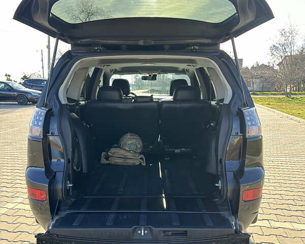 Черный Мицубиси Аутлендер ХЛ, объемом двигателя 2.4 л и пробегом 198 тыс. км за 11000 $, фото 9 на Automoto.ua