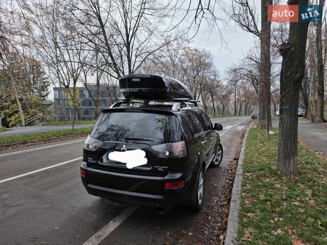 Черный Мицубиси Аутлендер ХЛ, объемом двигателя 2 л и пробегом 186 тыс. км за 10000 $, фото 1 на Automoto.ua
