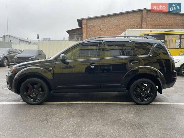 Черный Мицубиси Аутлендер ХЛ, объемом двигателя 2.4 л и пробегом 198 тыс. км за 9200 $, фото 1 на Automoto.ua