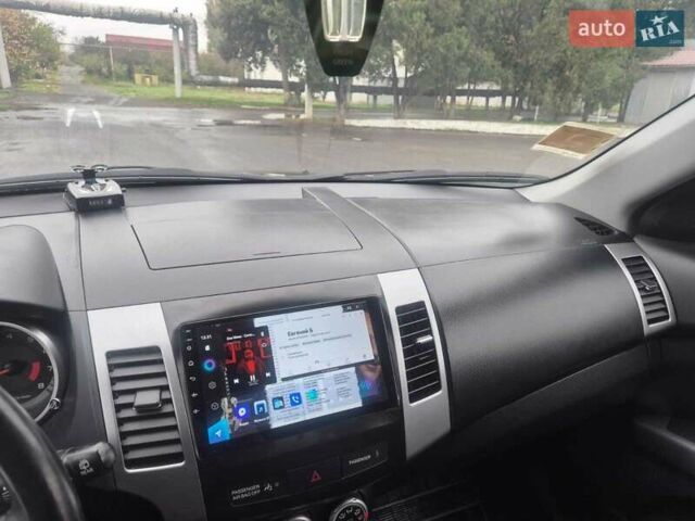 Черный Мицубиси Аутлендер ХЛ, объемом двигателя 2.36 л и пробегом 87 тыс. км за 11500 $, фото 9 на Automoto.ua
