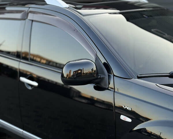 Чорний Міцубісі Аутлендер ХЛ, об'ємом двигуна 3 л та пробігом 243 тис. км за 12500 $, фото 10 на Automoto.ua