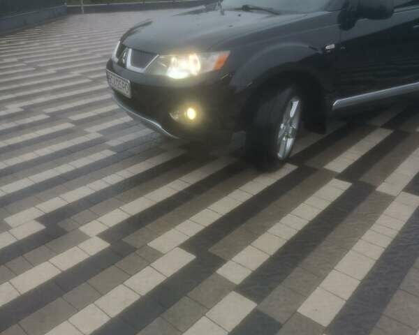 Черный Мицубиси Аутлендер ХЛ, объемом двигателя 2.36 л и пробегом 270 тыс. км за 9200 $, фото 10 на Automoto.ua