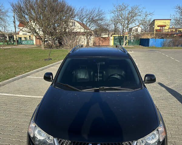 Черный Мицубиси Аутлендер ХЛ, объемом двигателя 2.4 л и пробегом 198 тыс. км за 11000 $, фото 3 на Automoto.ua