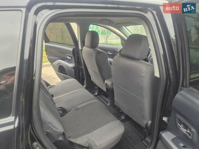 Черный Мицубиси Аутлендер ХЛ, объемом двигателя 2.36 л и пробегом 87 тыс. км за 11500 $, фото 4 на Automoto.ua