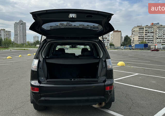 Черный Мицубиси Аутлендер ХЛ, объемом двигателя 2.4 л и пробегом 212 тыс. км за 9350 $, фото 6 на Automoto.ua