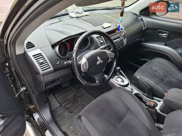 Черный Мицубиси Аутлендер ХЛ, объемом двигателя 2.4 л и пробегом 127 тыс. км за 10500 $, фото 32 на Automoto.ua