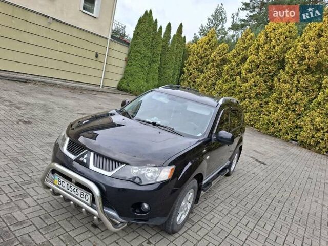 Черный Мицубиси Аутлендер ХЛ, объемом двигателя 2.4 л и пробегом 127 тыс. км за 10500 $, фото 2 на Automoto.ua
