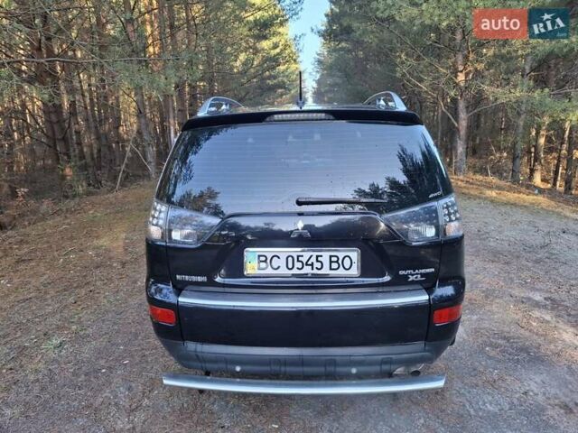Черный Мицубиси Аутлендер ХЛ, объемом двигателя 2.4 л и пробегом 127 тыс. км за 10500 $, фото 22 на Automoto.ua