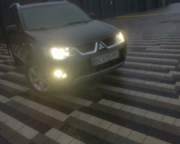 Черный Мицубиси Аутлендер ХЛ, объемом двигателя 2.36 л и пробегом 270 тыс. км за 9200 $, фото 3 на Automoto.ua