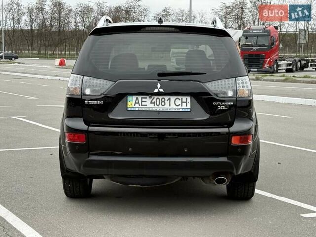Черный Мицубиси Аутлендер ХЛ, объемом двигателя 2.36 л и пробегом 175 тыс. км за 9700 $, фото 6 на Automoto.ua