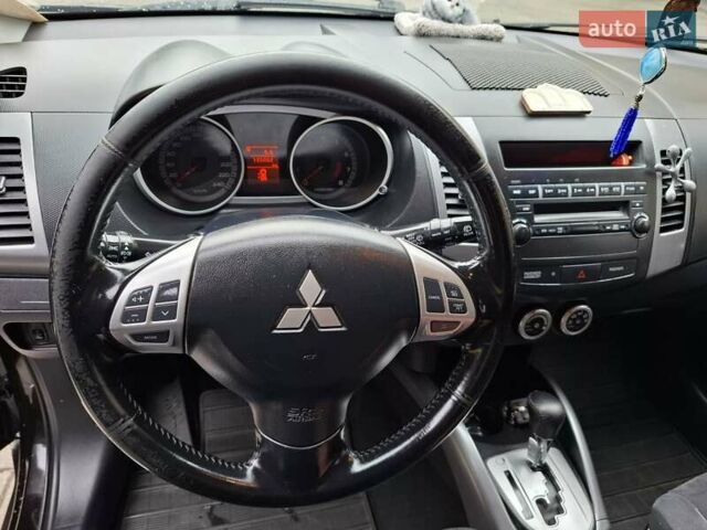 Черный Мицубиси Аутлендер ХЛ, объемом двигателя 2.4 л и пробегом 127 тыс. км за 10500 $, фото 37 на Automoto.ua