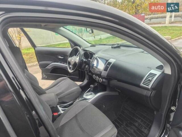 Черный Мицубиси Аутлендер ХЛ, объемом двигателя 2.36 л и пробегом 87 тыс. км за 11500 $, фото 5 на Automoto.ua