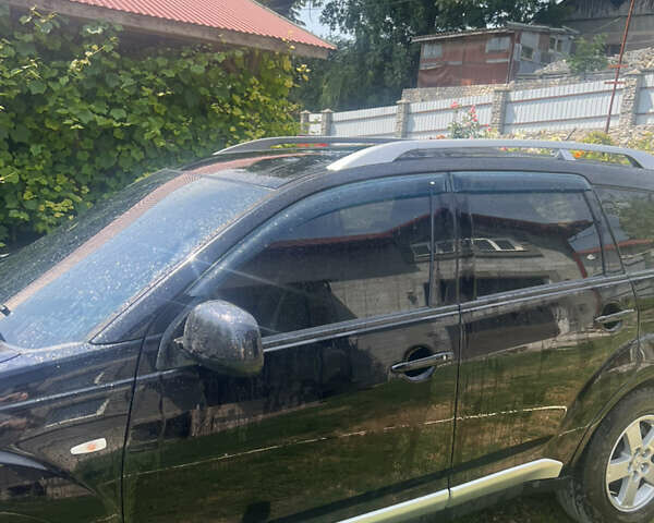 Черный Мицубиси Аутлендер ХЛ, объемом двигателя 2.36 л и пробегом 268 тыс. км за 8800 $, фото 6 на Automoto.ua