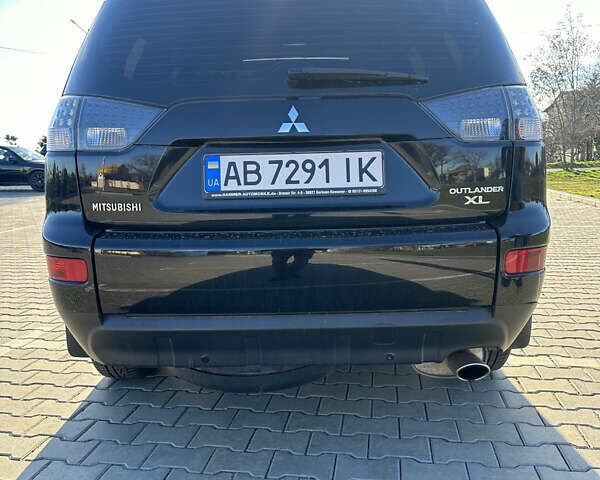 Черный Мицубиси Аутлендер ХЛ, объемом двигателя 2.4 л и пробегом 198 тыс. км за 11000 $, фото 11 на Automoto.ua