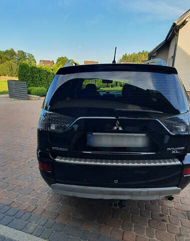 Черный Мицубиси Аутлендер ХЛ, объемом двигателя 2.4 л и пробегом 146 тыс. км за 10500 $, фото 6 на Automoto.ua