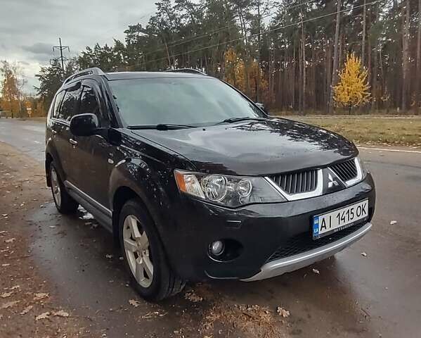 Черный Мицубиси Аутлендер ХЛ, объемом двигателя 3 л и пробегом 240 тыс. км за 9400 $, фото 1 на Automoto.ua