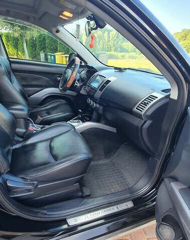 Черный Мицубиси Аутлендер ХЛ, объемом двигателя 2.4 л и пробегом 146 тыс. км за 10500 $, фото 9 на Automoto.ua