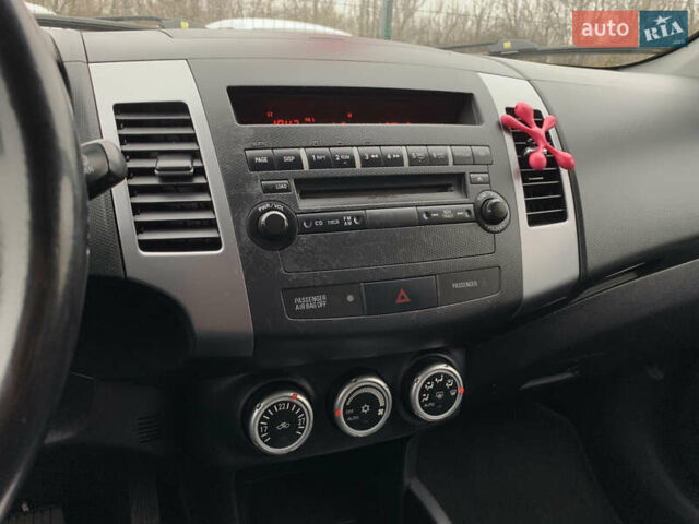 Черный Мицубиси Аутлендер ХЛ, объемом двигателя 2.4 л и пробегом 175 тыс. км за 10499 $, фото 48 на Automoto.ua