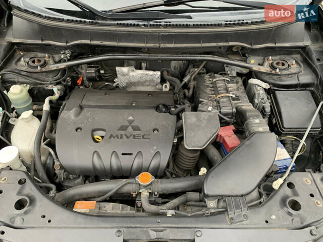 Черный Мицубиси Аутлендер ХЛ, объемом двигателя 2.4 л и пробегом 175 тыс. км за 10499 $, фото 50 на Automoto.ua