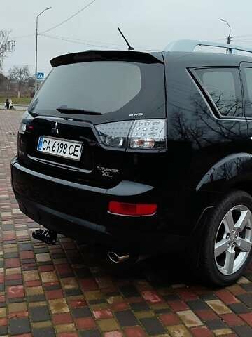 Чорний Міцубісі Аутлендер ХЛ, об'ємом двигуна 2.36 л та пробігом 150 тис. км за 11100 $, фото 7 на Automoto.ua