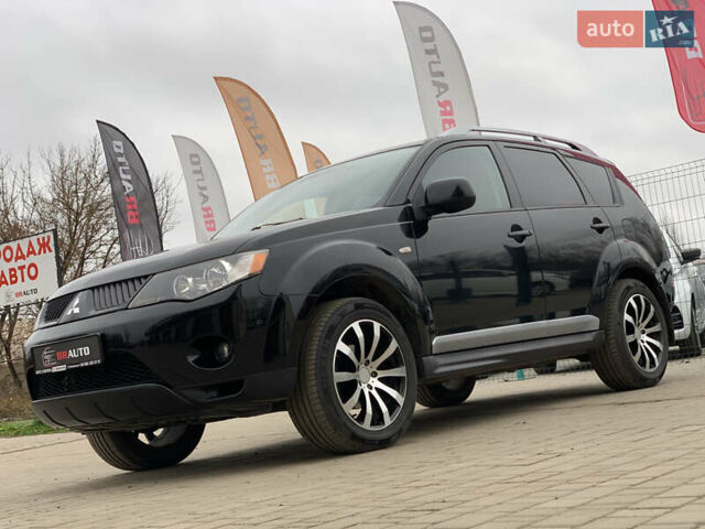 Черный Мицубиси Аутлендер ХЛ, объемом двигателя 2.4 л и пробегом 175 тыс. км за 10499 $, фото 1 на Automoto.ua
