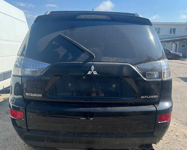 Черный Мицубиси Аутлендер ХЛ, объемом двигателя 2 л и пробегом 200 тыс. км за 2450 $, фото 1 на Automoto.ua