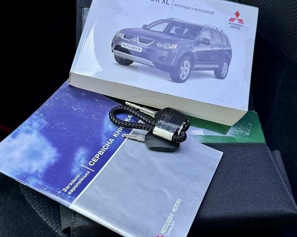 Черный Мицубиси Аутлендер ХЛ, объемом двигателя 2 л и пробегом 225 тыс. км за 9900 $, фото 31 на Automoto.ua