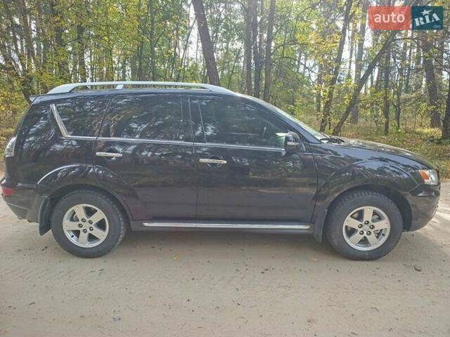 Чорний Міцубісі Аутлендер ХЛ, об'ємом двигуна 2.4 л та пробігом 175 тис. км за 10800 $, фото 1 на Automoto.ua