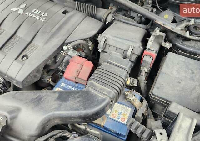 Мицубиси Аутлендер ХЛ 2010 в Днепре (Днепропетровске) на Automoto.ua Черный Мицубиси Аутлендер ХЛ, объемом двигателя 2.3 л и пробегом 193 тыс. км за 14999 $, фото 24 на Automoto.ua