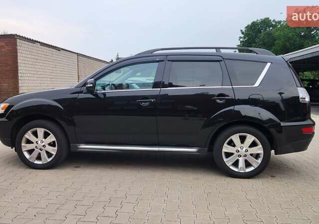 Мицубиси Аутлендер ХЛ 2010 в Днепре (Днепропетровске) на Automoto.ua Черный Мицубиси Аутлендер ХЛ, объемом двигателя 2.3 л и пробегом 193 тыс. км за 14999 $, фото 7 на Automoto.ua