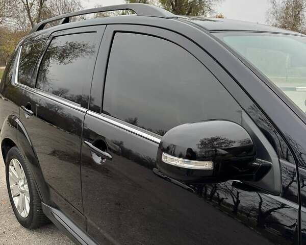 Черный Мицубиси Аутлендер ХЛ, объемом двигателя 2.18 л и пробегом 253 тыс. км за 12500 $, фото 13 на Automoto.ua