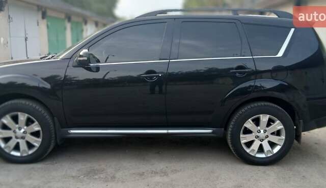 Черный Мицубиси Аутлендер ХЛ, объемом двигателя 2.3 л и пробегом 190 тыс. км за 12500 $, фото 2 на Automoto.ua