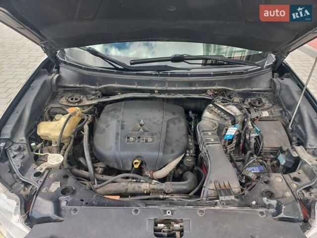 Черный Мицубиси Аутлендер ХЛ, объемом двигателя 2.2 л и пробегом 232 тыс. км за 11600 $, фото 612 на Automoto.ua