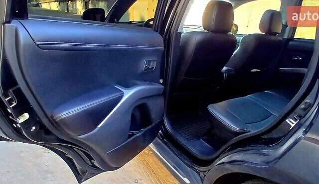 Черный Мицубиси Аутлендер ХЛ, объемом двигателя 2.3 л и пробегом 190 тыс. км за 12500 $, фото 20 на Automoto.ua